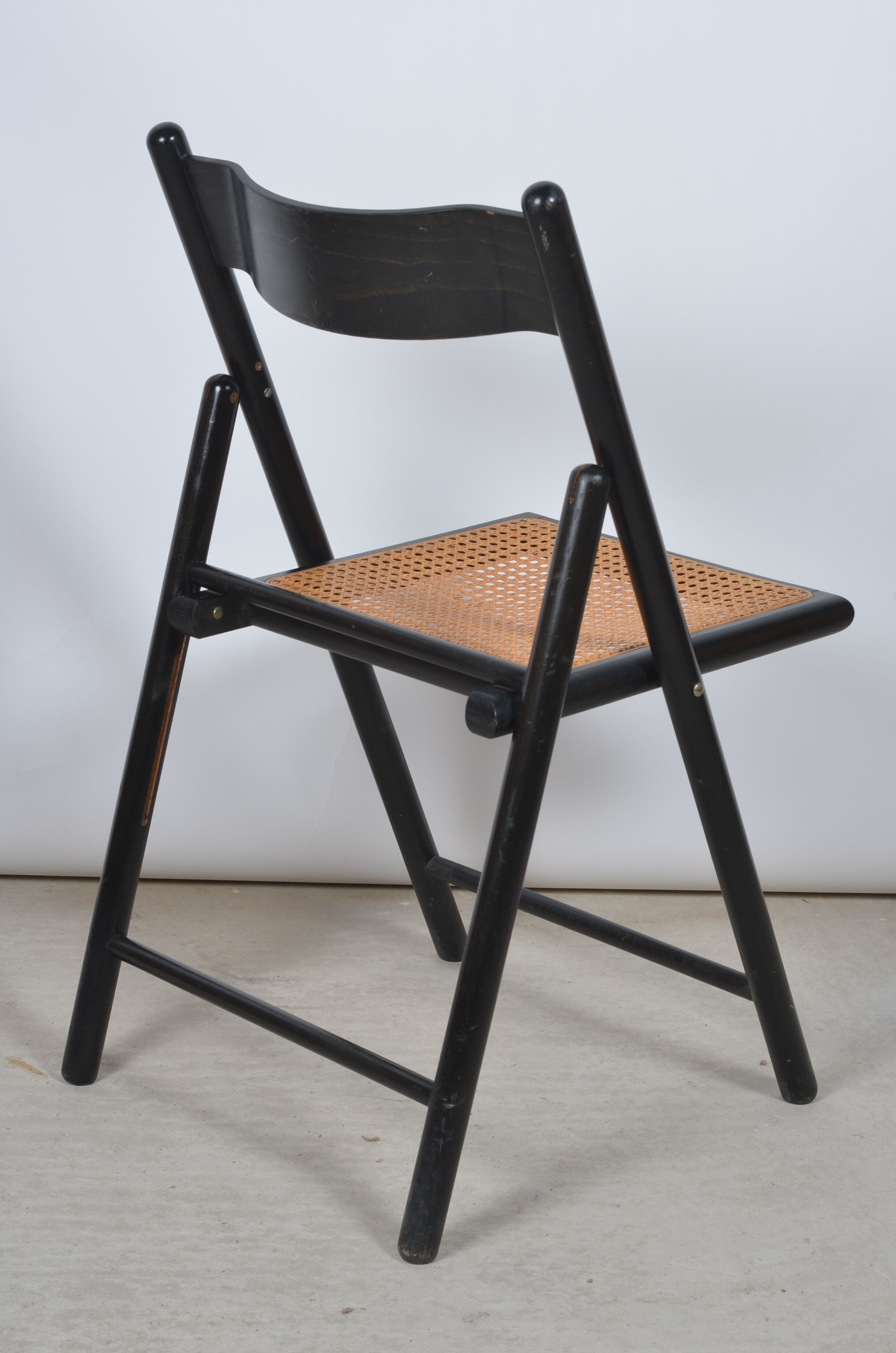 Folding chair seated in cannage