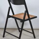 Folding chair seated in cannage