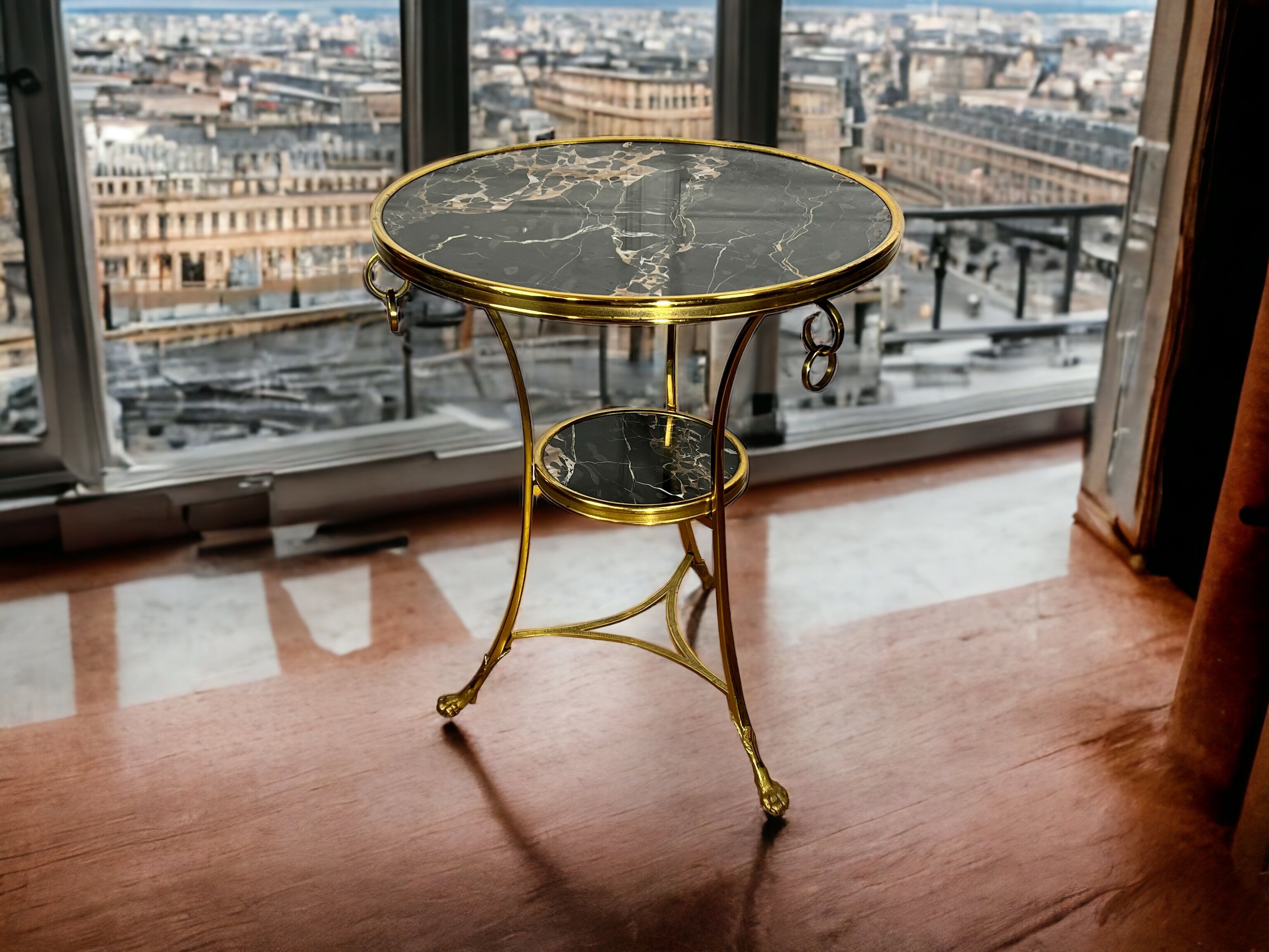 Gueridon tripod with gilded bronze frame covered with portor marble
