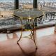 Gueridon tripod with gilded bronze frame covered with portor marble
