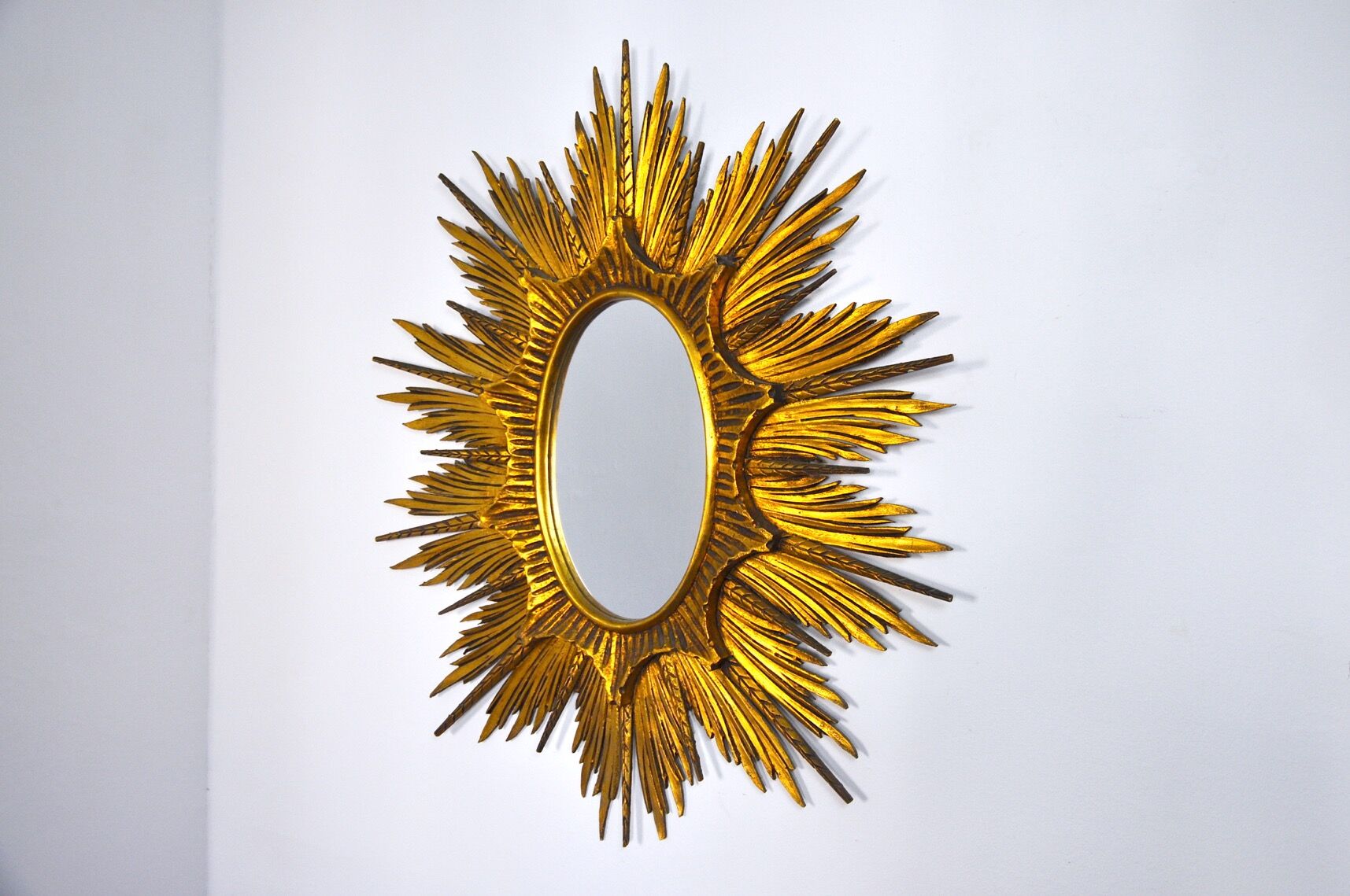 Miroir soleil et épis en bois dorée début XXème 99cm