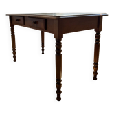 English-style wooden desk with a green leather writing pad.