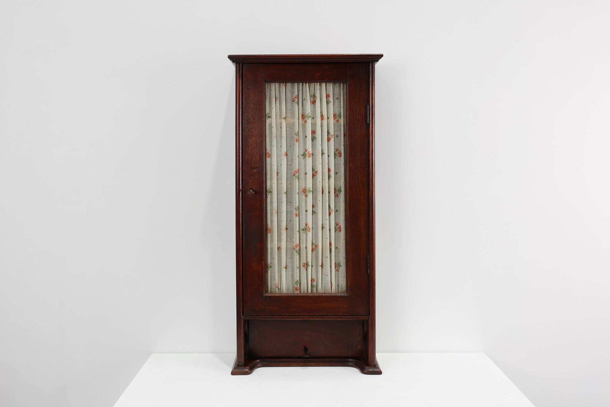 French Art Deco tall cabinet with glass door and hidden compartiment, ca. 1