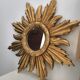 Miroir soleil doré