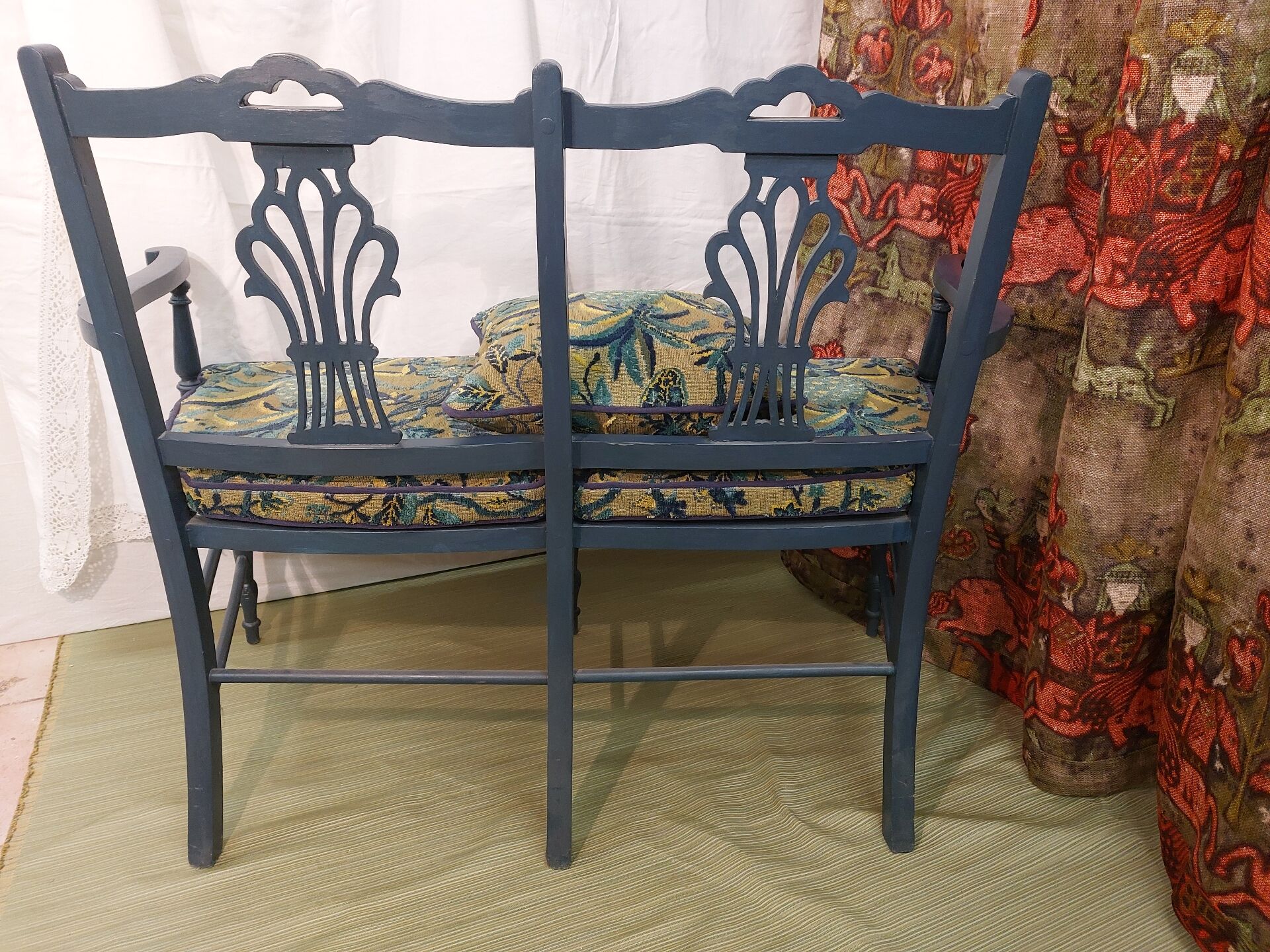 Pretty painted and upholstered bench in green and blue.