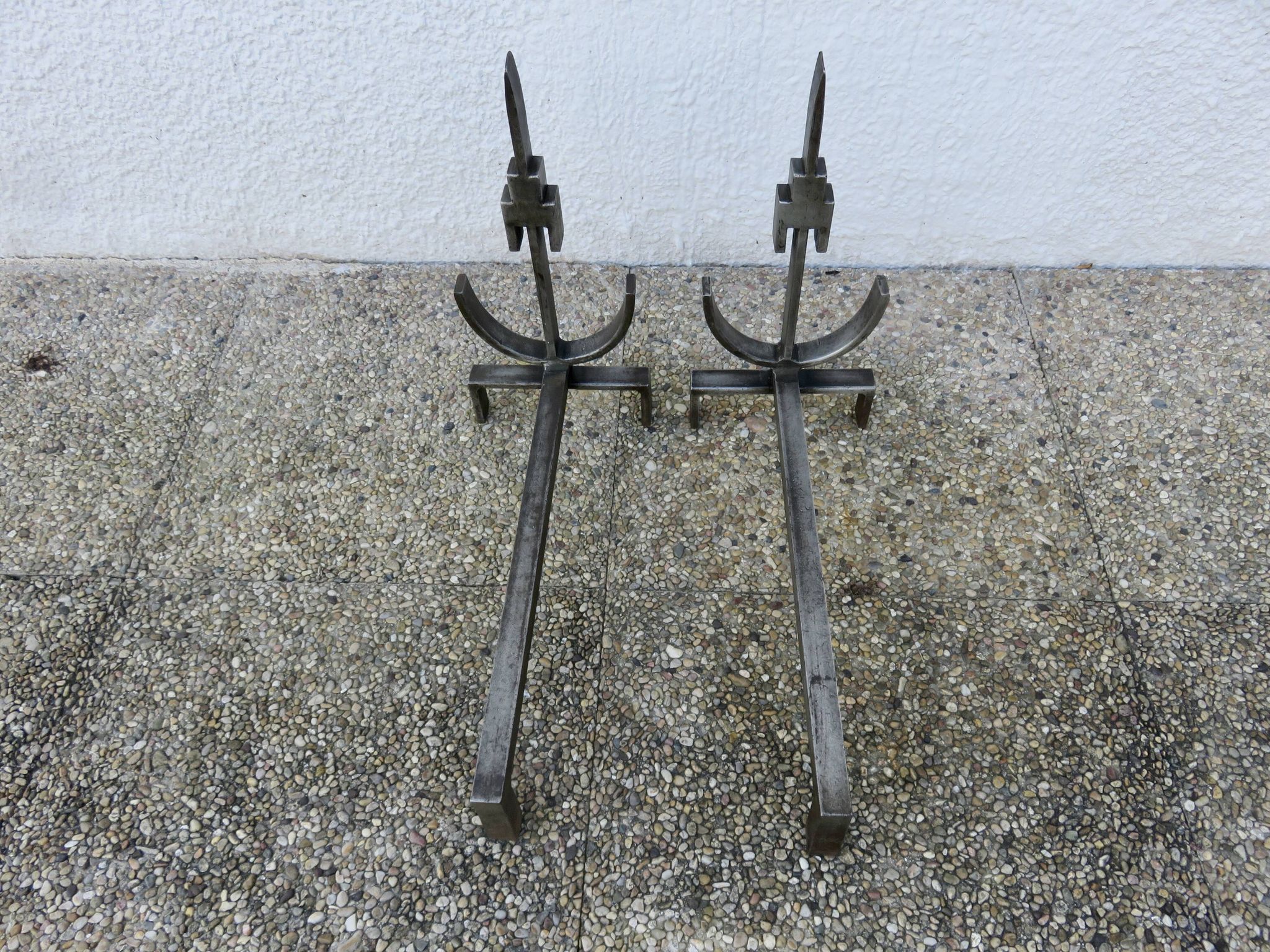 Pair of modernist andirons in forged and hammered steel, French work
