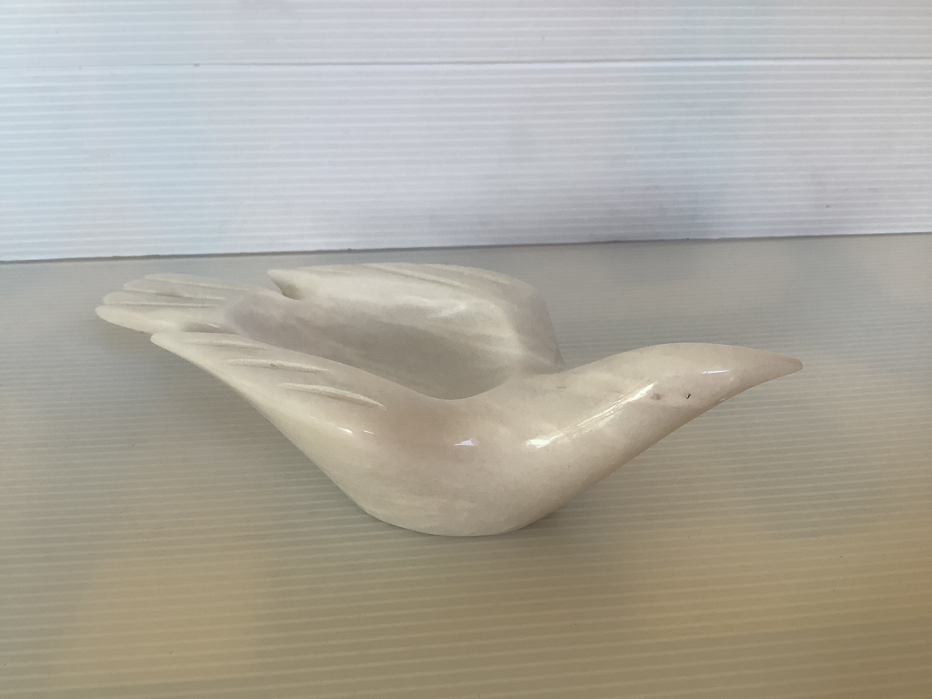 Marble bird empty pocket