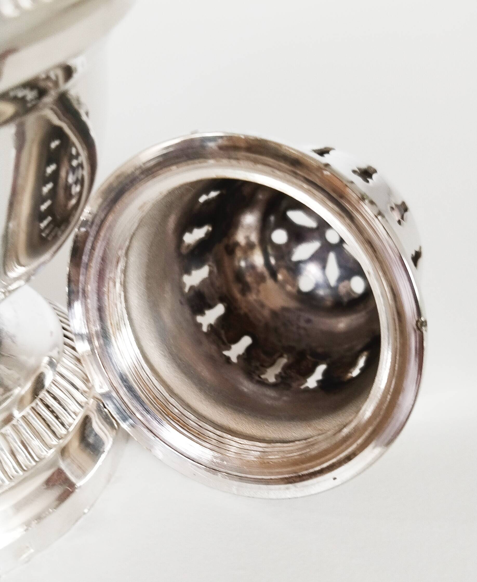 Silver-plated sugar shaker with fluted edges