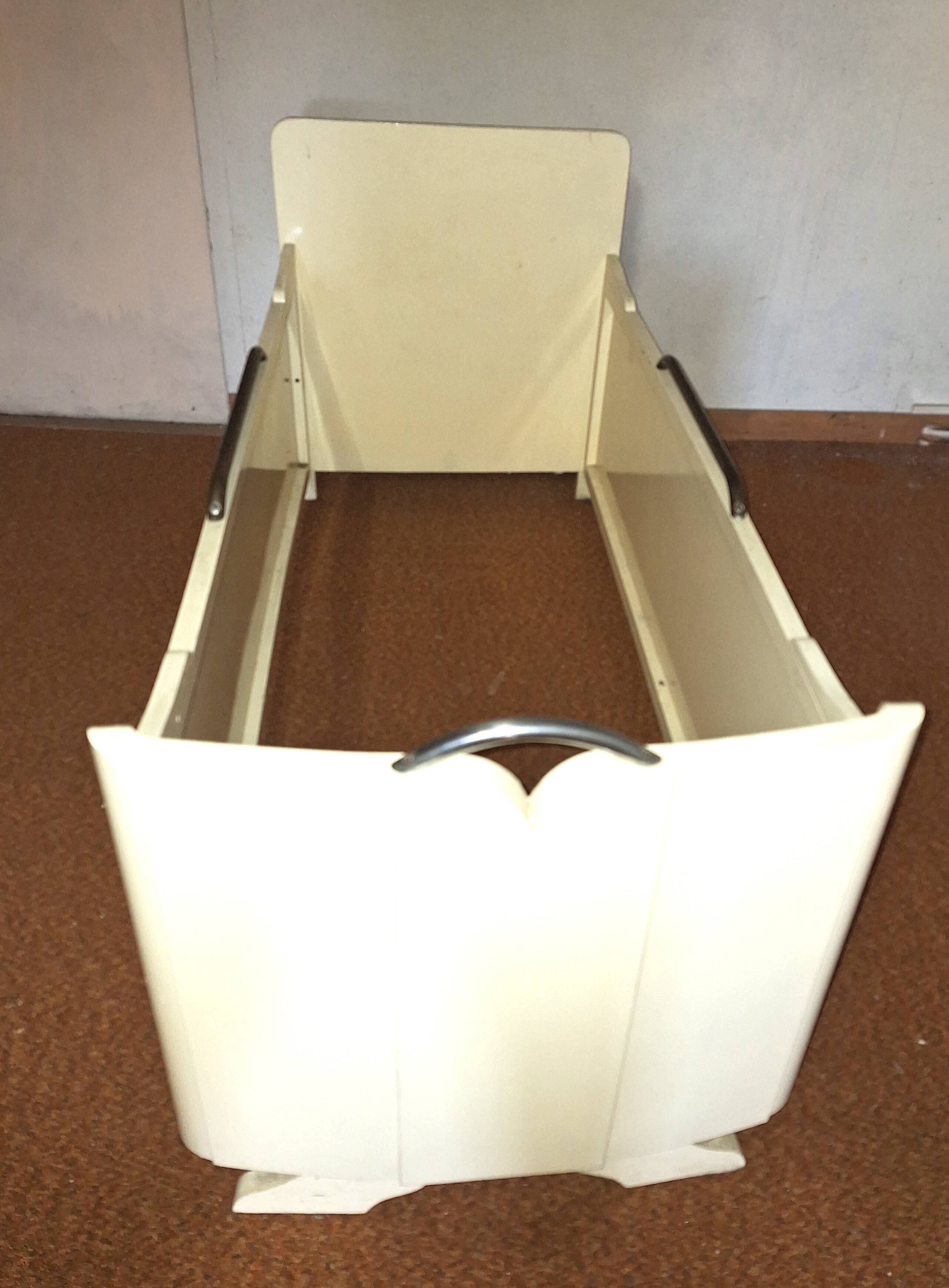 Painted wooden child's bed.