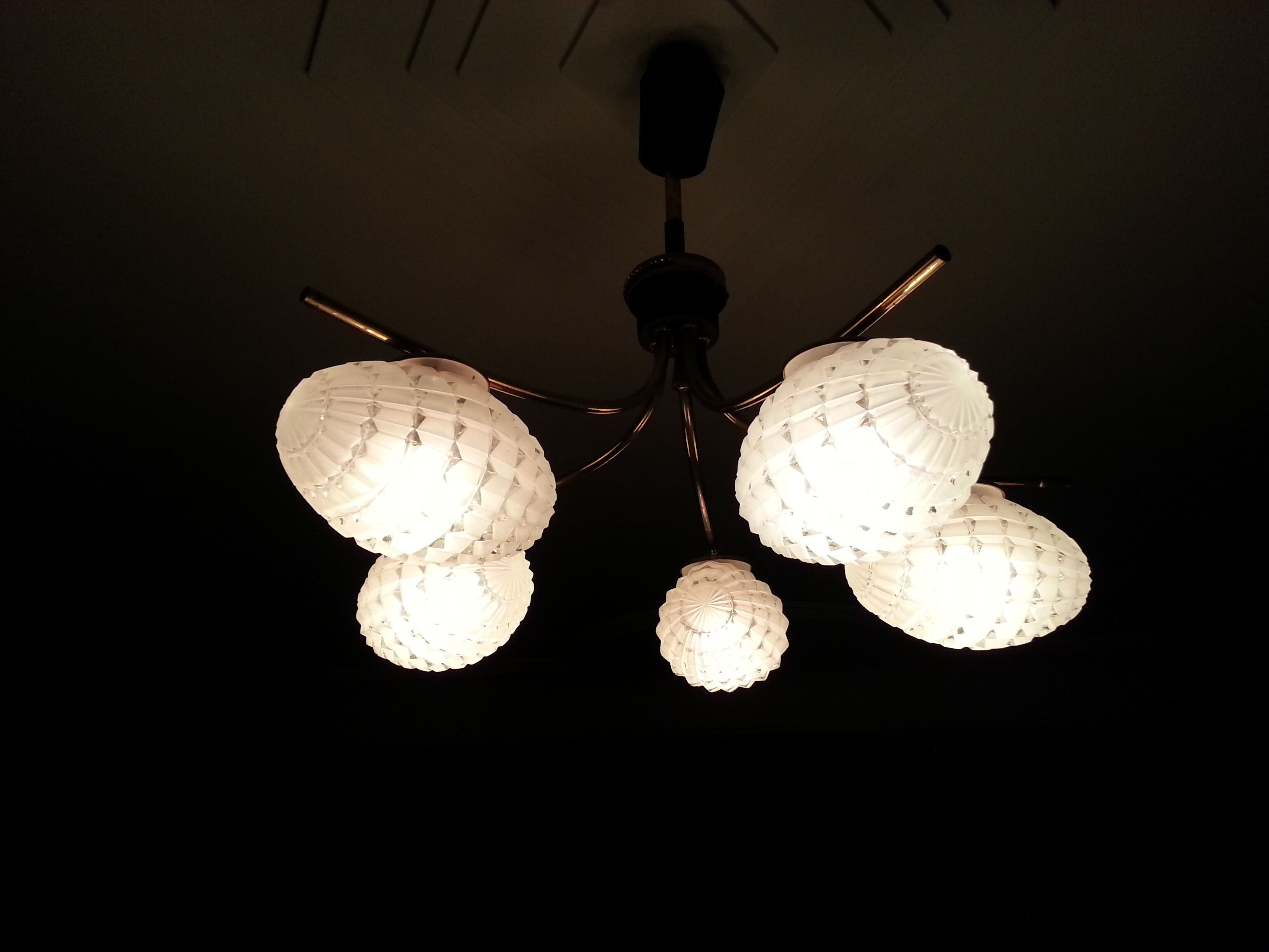 Cosmic brass and chiseled glass chandelier