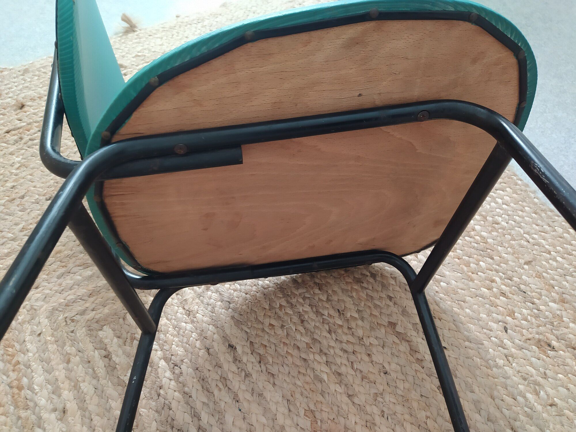 Vintage chair in turquoise green vinyl with black metal legs