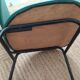 Vintage chair in turquoise green vinyl with black metal legs
