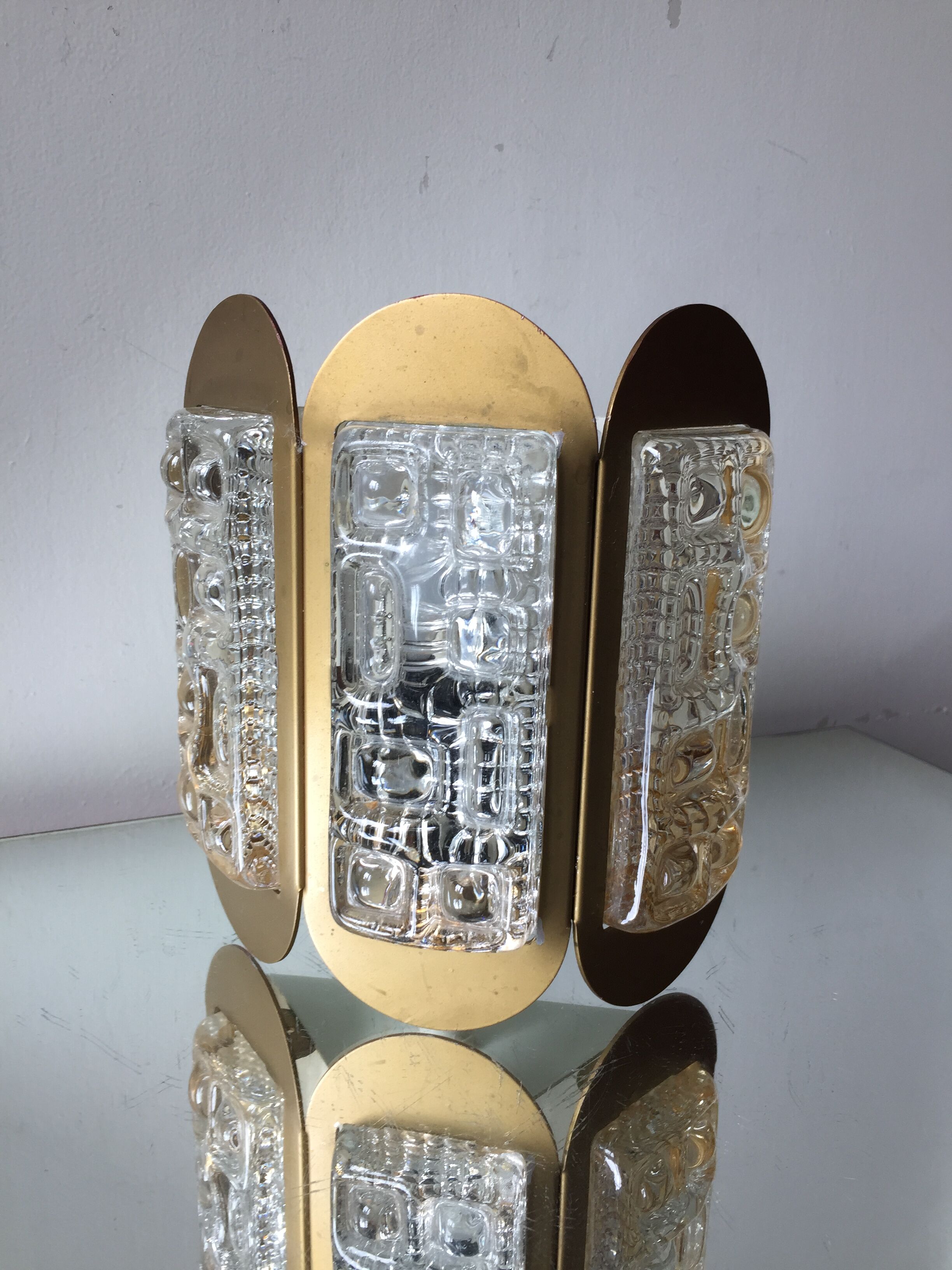 Scandinavian midcentury wall light in crystal and mat gold colored metal
