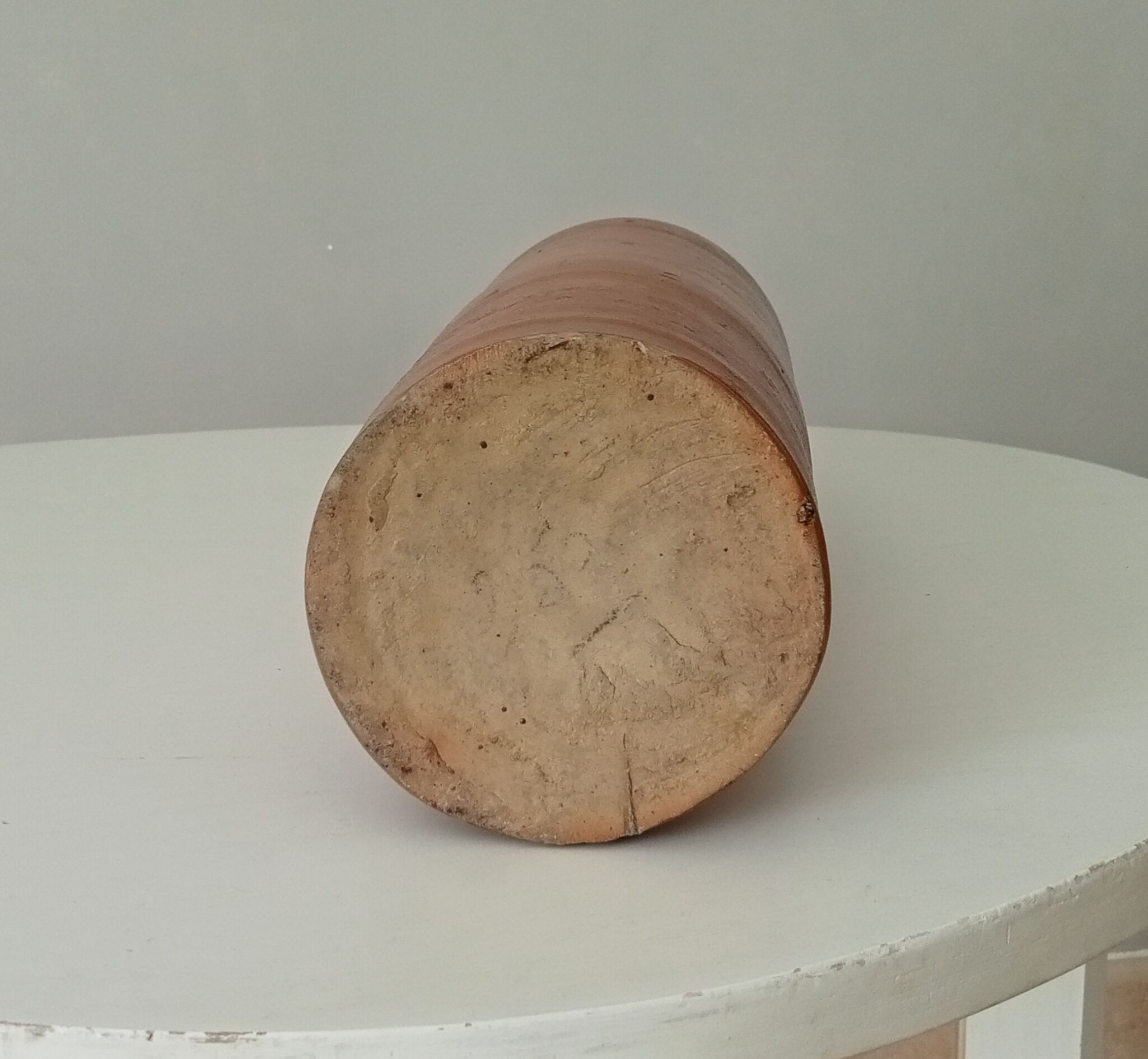 Old bottle in glazed sandstone