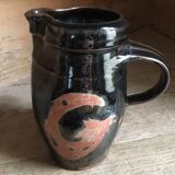 Ceramic pitcher. Belly shape. Motives on both sides
