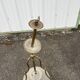Antique brass chandelier with 3 lights and frosted glass shades.