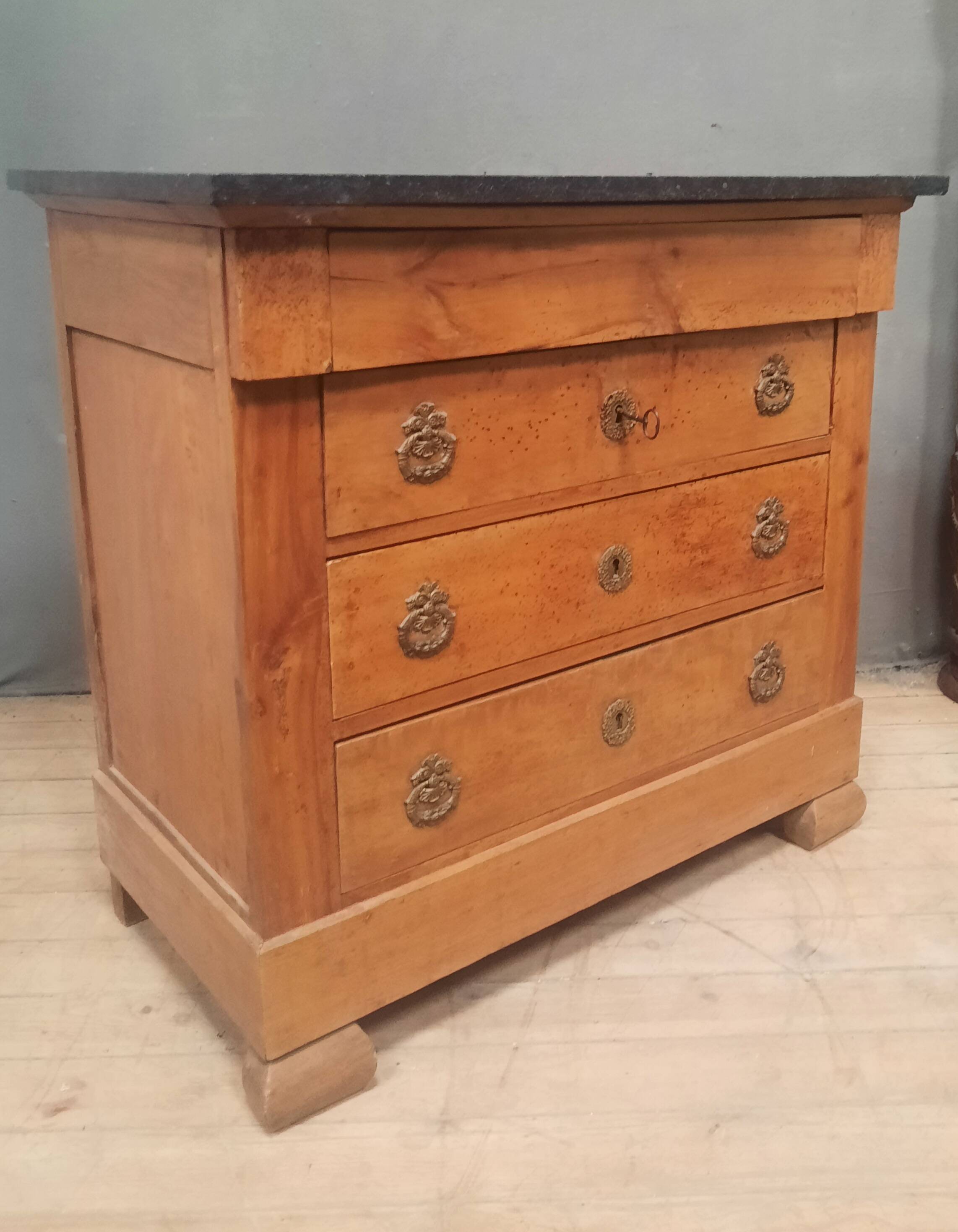 Nineteenth-century commode with marble top.