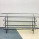 Mid-century console with glass top and metal frame.