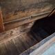 Rustic French antique storage bench from the 18th century in walnut and pine.