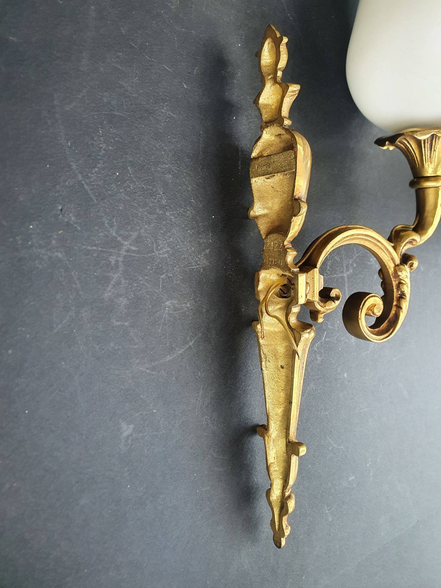 Three large vintage torch wall sconces.