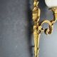 Three large vintage torch wall sconces.