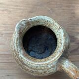 Small beige speckled stoneware pitcher