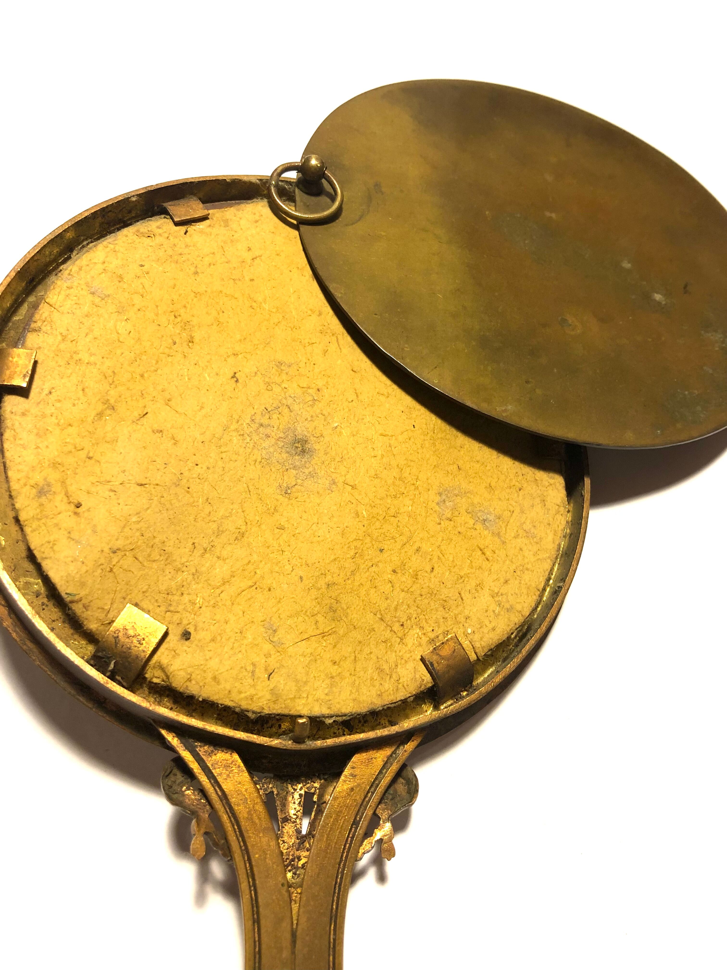 Courtesy hand mirror