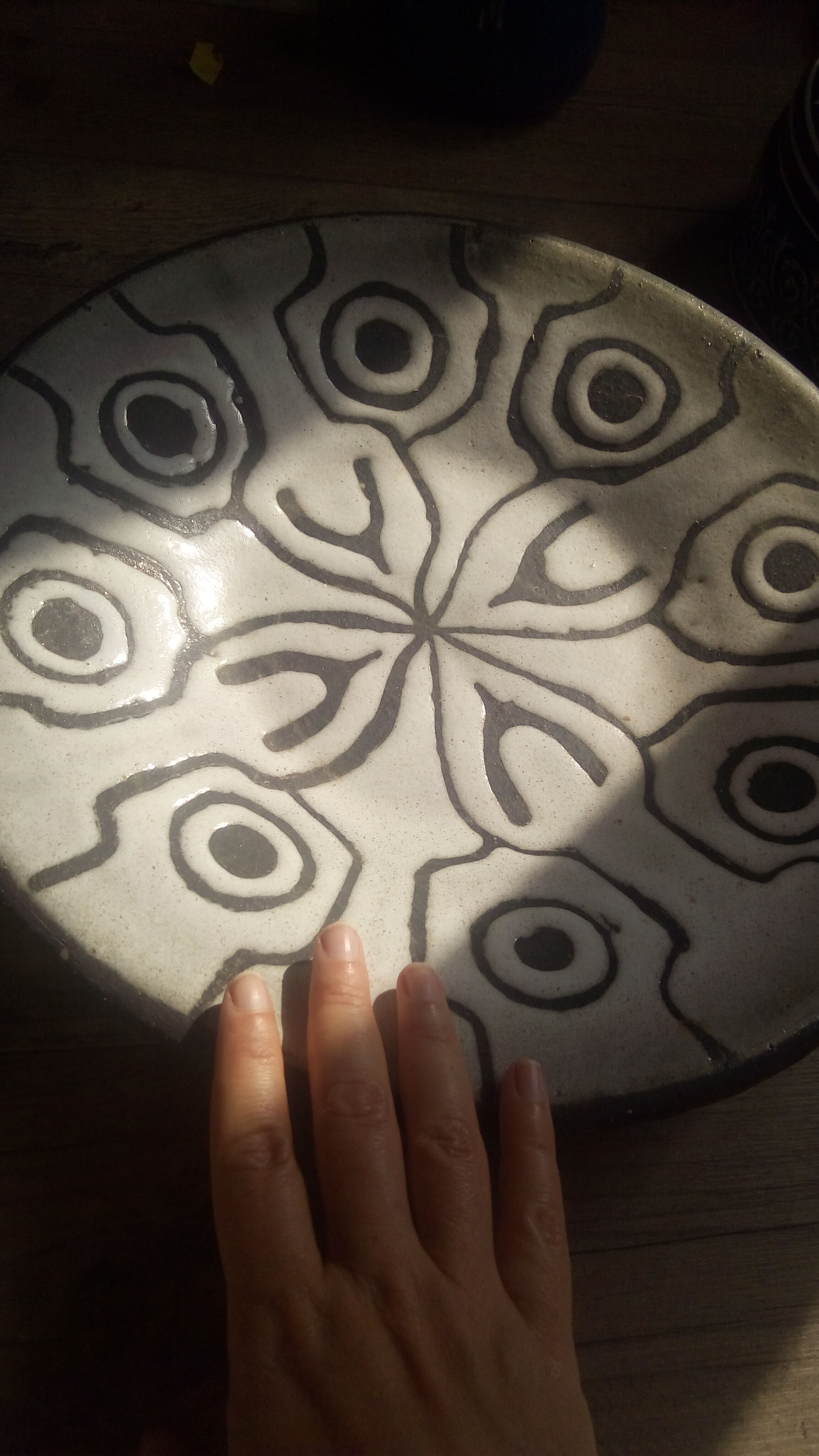 Large black and white brutalist dish