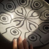 Large black and white brutalist dish