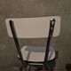 3 white Formica chairs