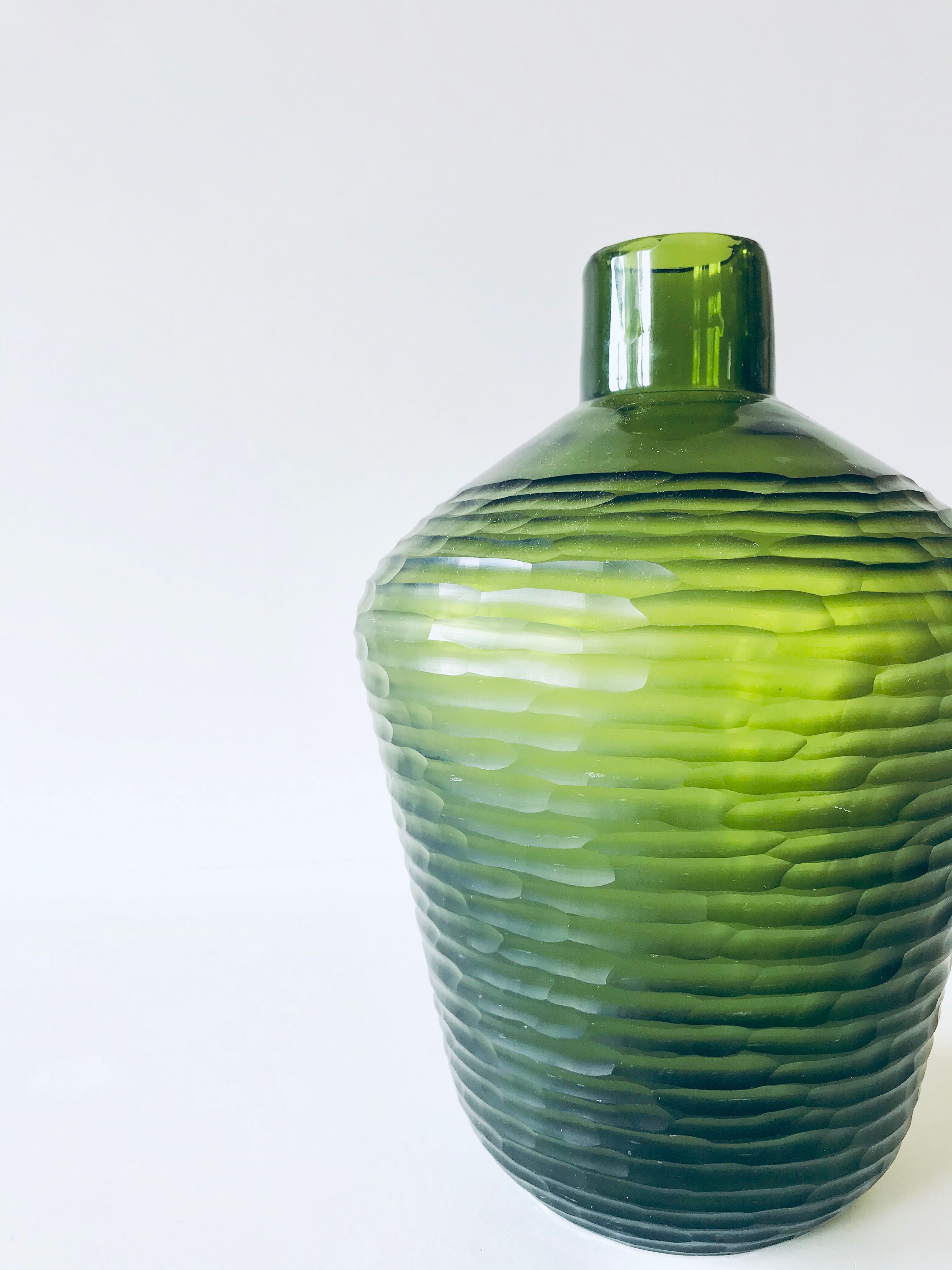 Green carved glass vase