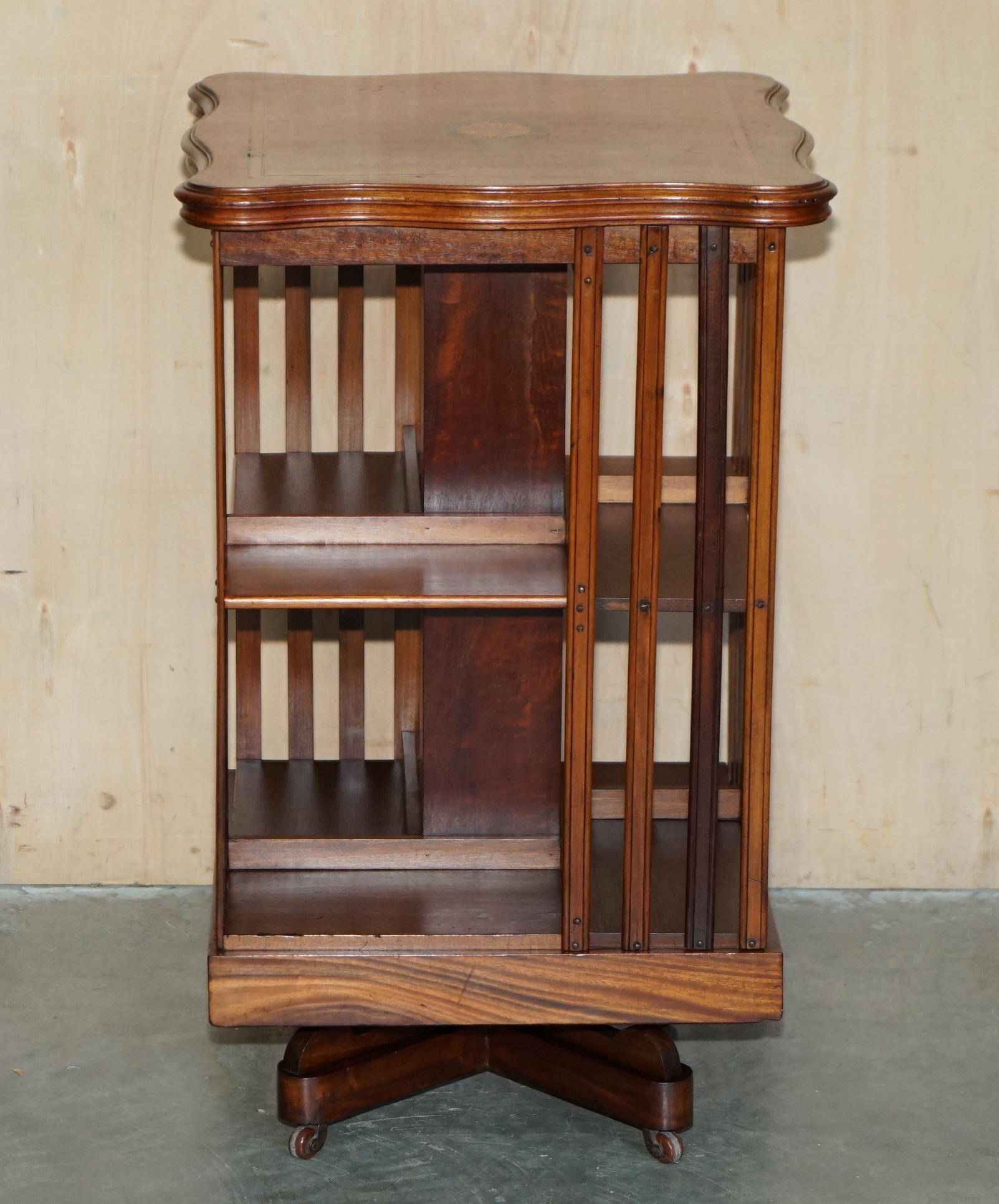 Sheraton-style rotating library table in walnut and satinwood.