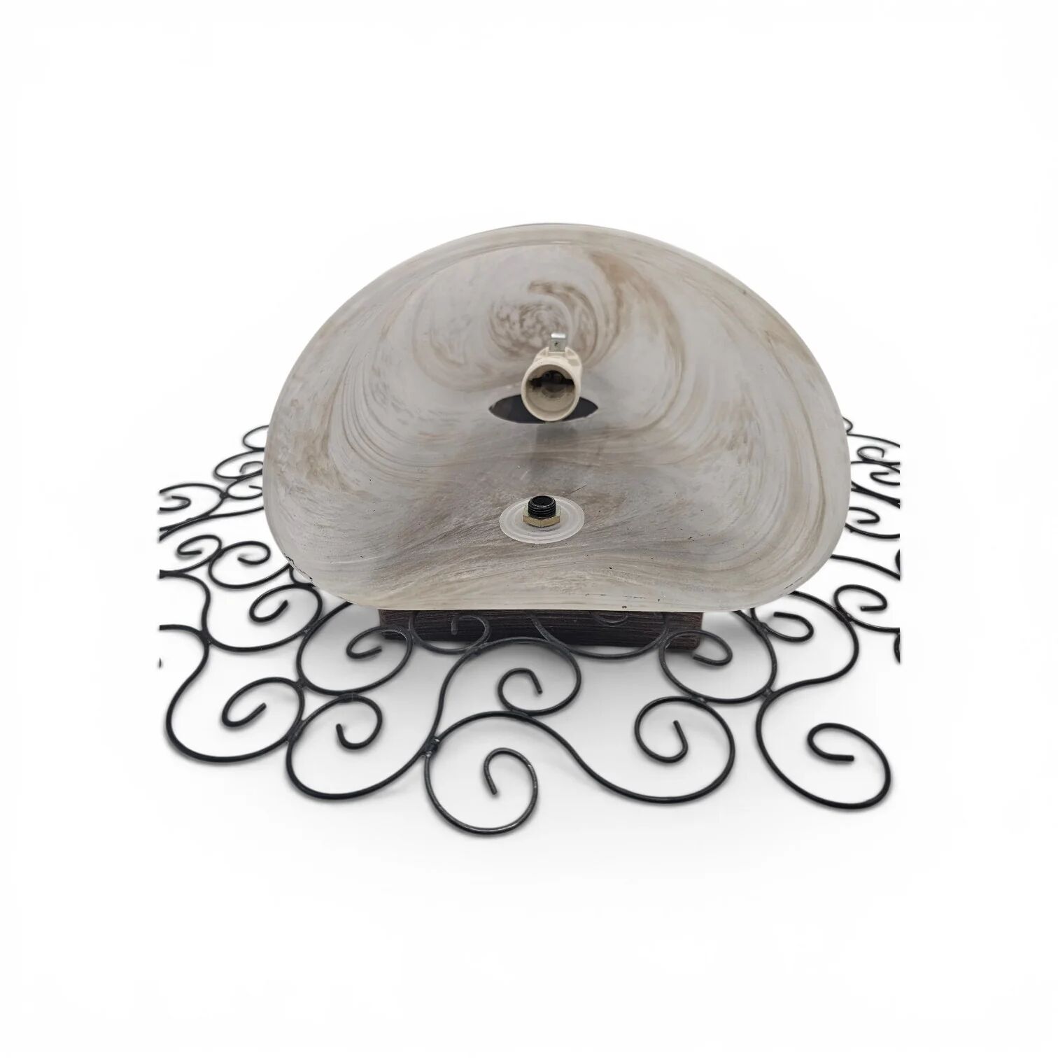 Wrought iron pocket wall sconces featuring a frosted amber glass / metal frame
