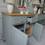 Compact buffet re-enchanted in grey-green, wooden top.