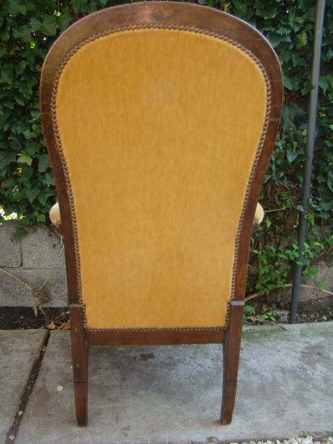 Old walnut Voltaire armchair