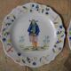 Malicorne earthenware plates, late nineteenth century, Breton décor.