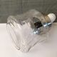 Vintage pendant light with laminated effect glass globe and chrome attachment
