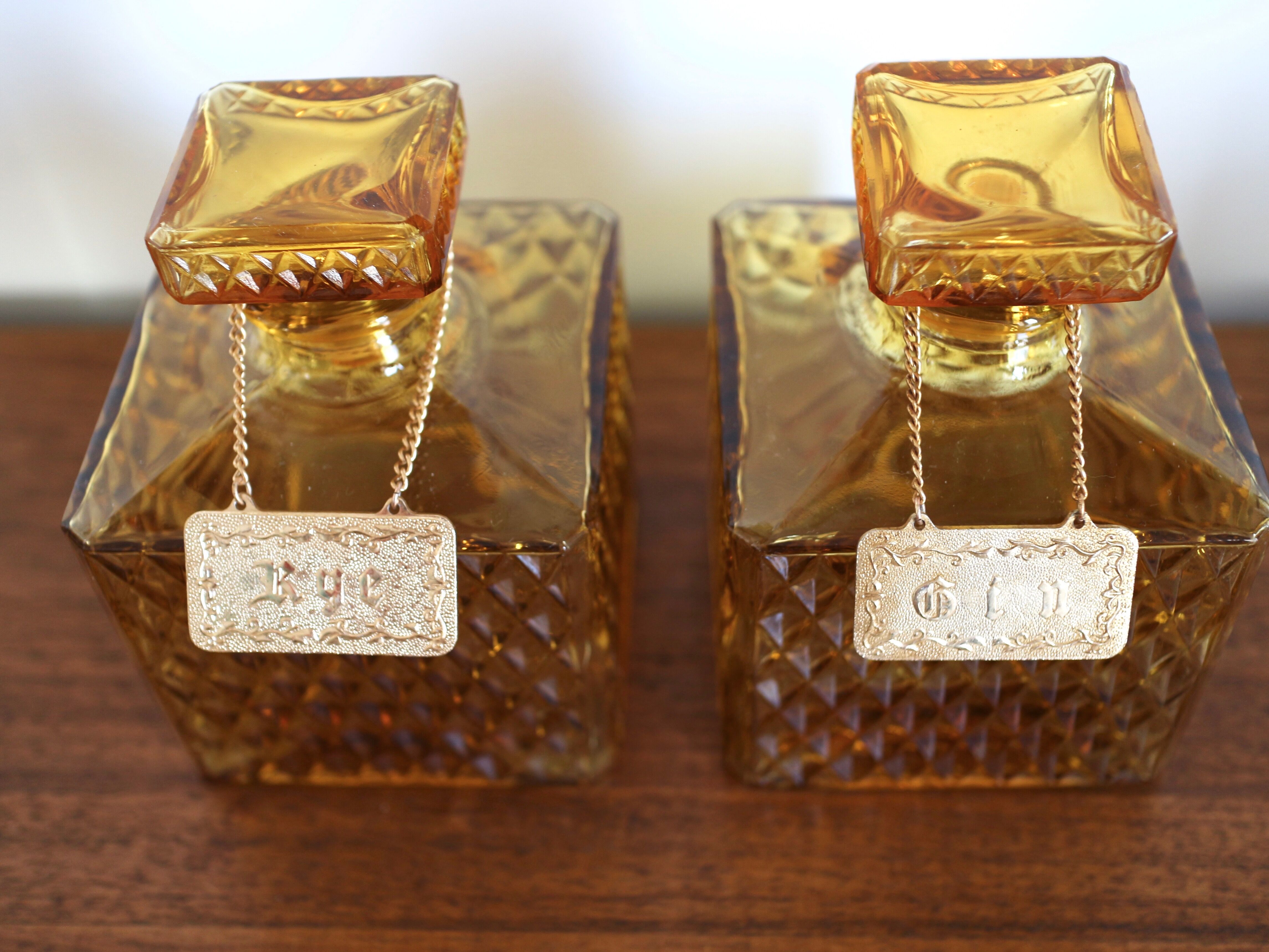 2 yellow glass whiskey carafes