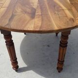 Round drop-leaf table made entirely of solid walnut