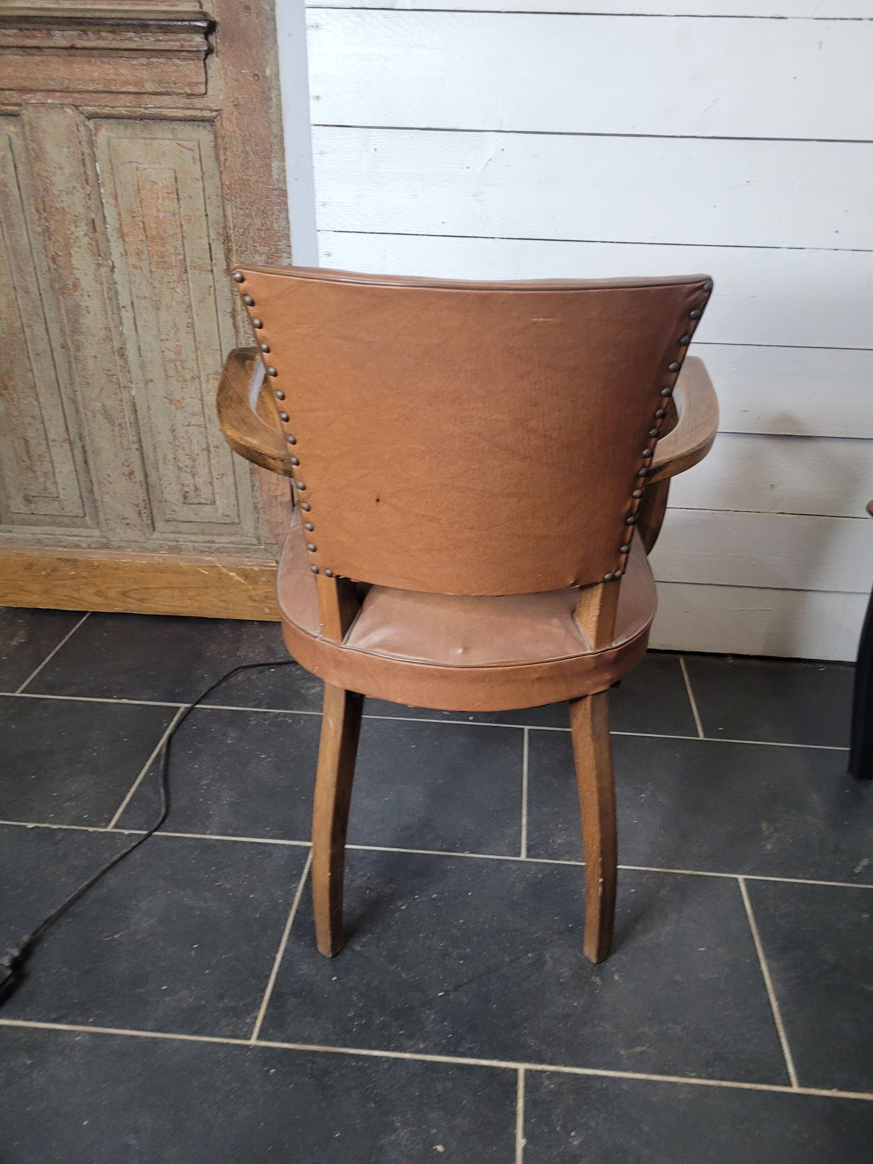 Bridge armchair in skai from the 60s