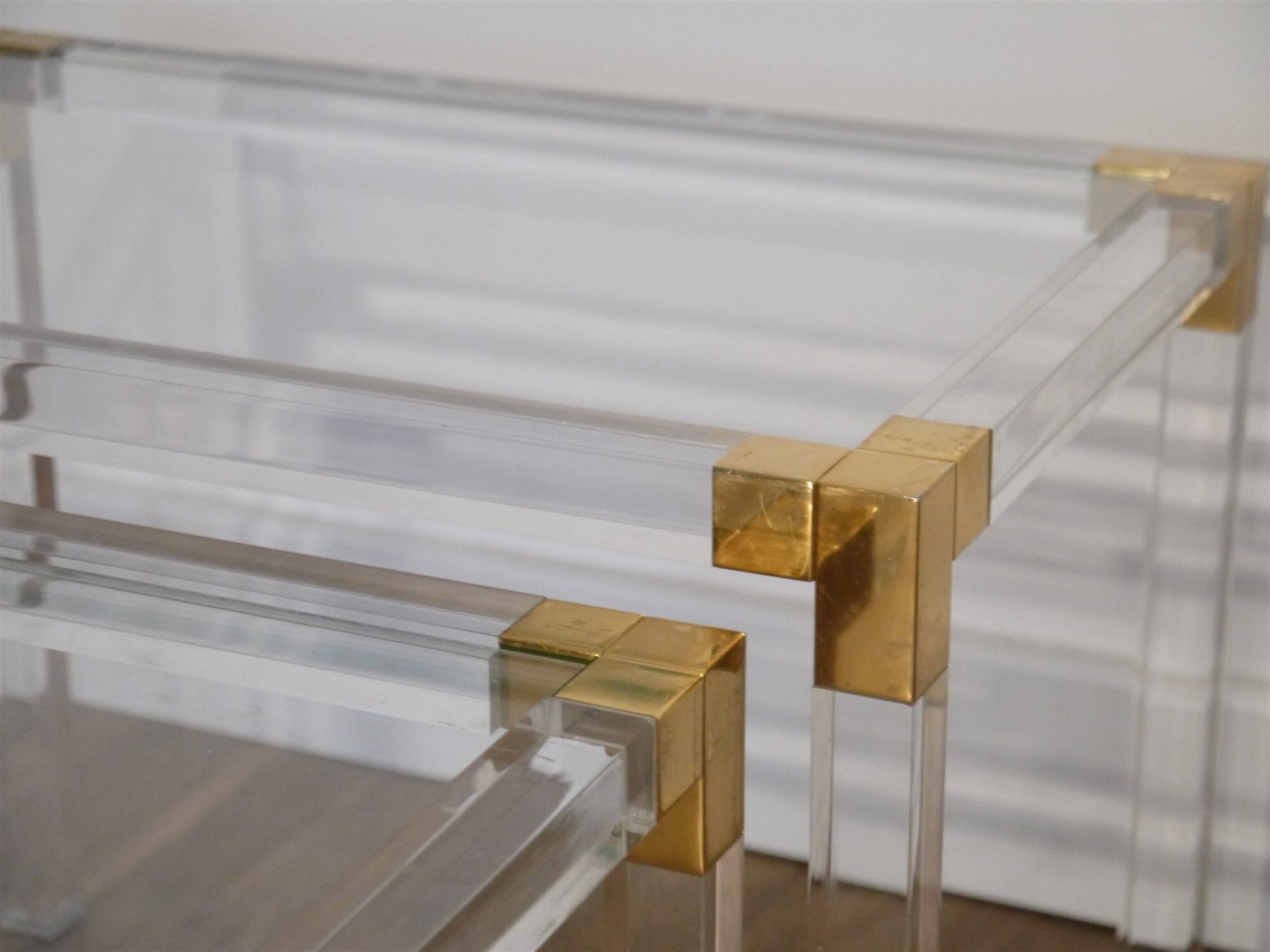 Nesting tables from the 1970s in brass, glass and lucite