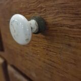 Antique craft cabinet with solid oak drawers and porcelain handles