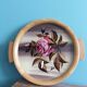 Round Art Deco plate, painted decoration signed, roses