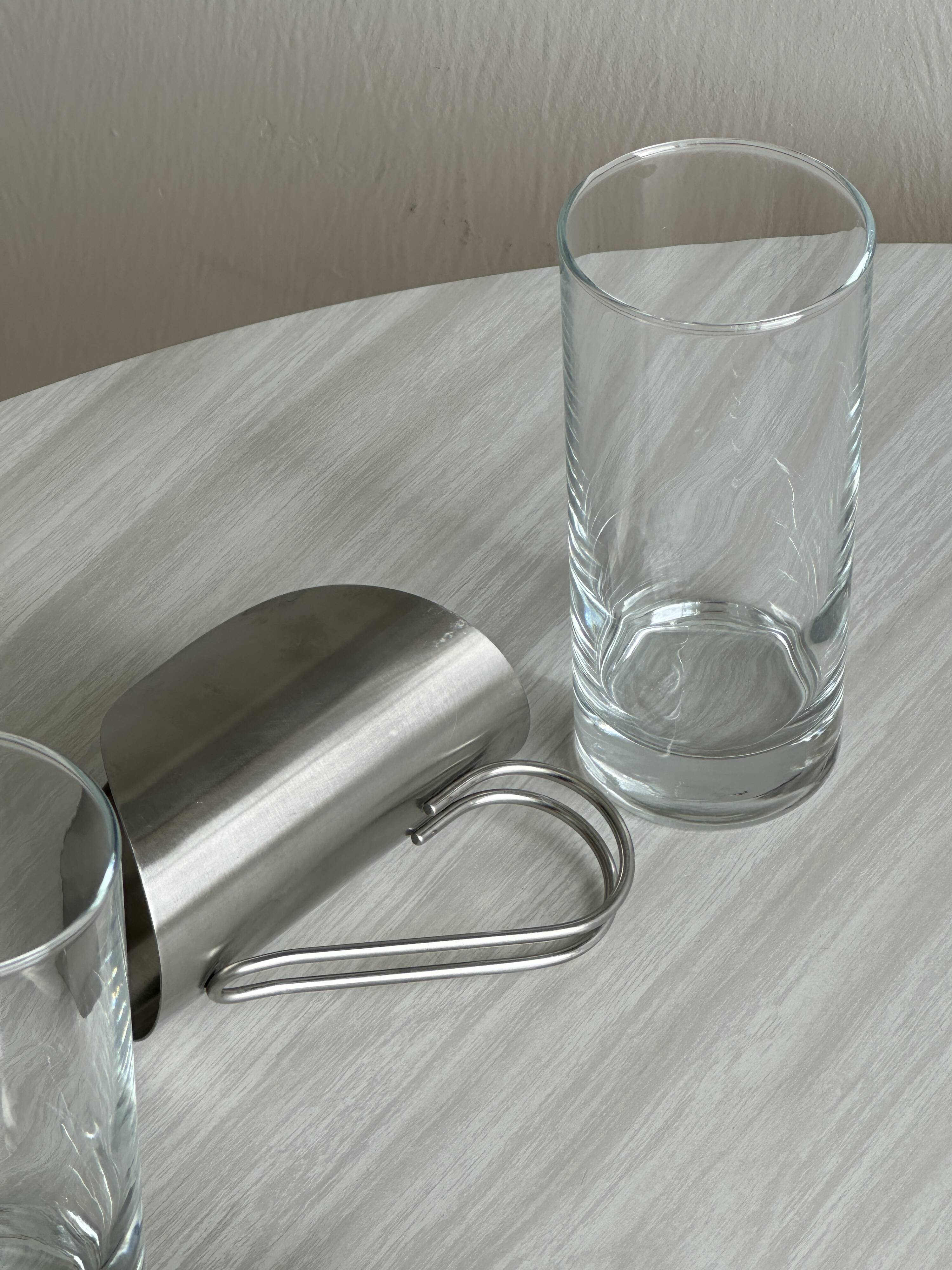 2 glasses with metal handles, stainless steel.