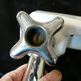 Old ceramic bathroom shelf with 2 chrome bronze faucets