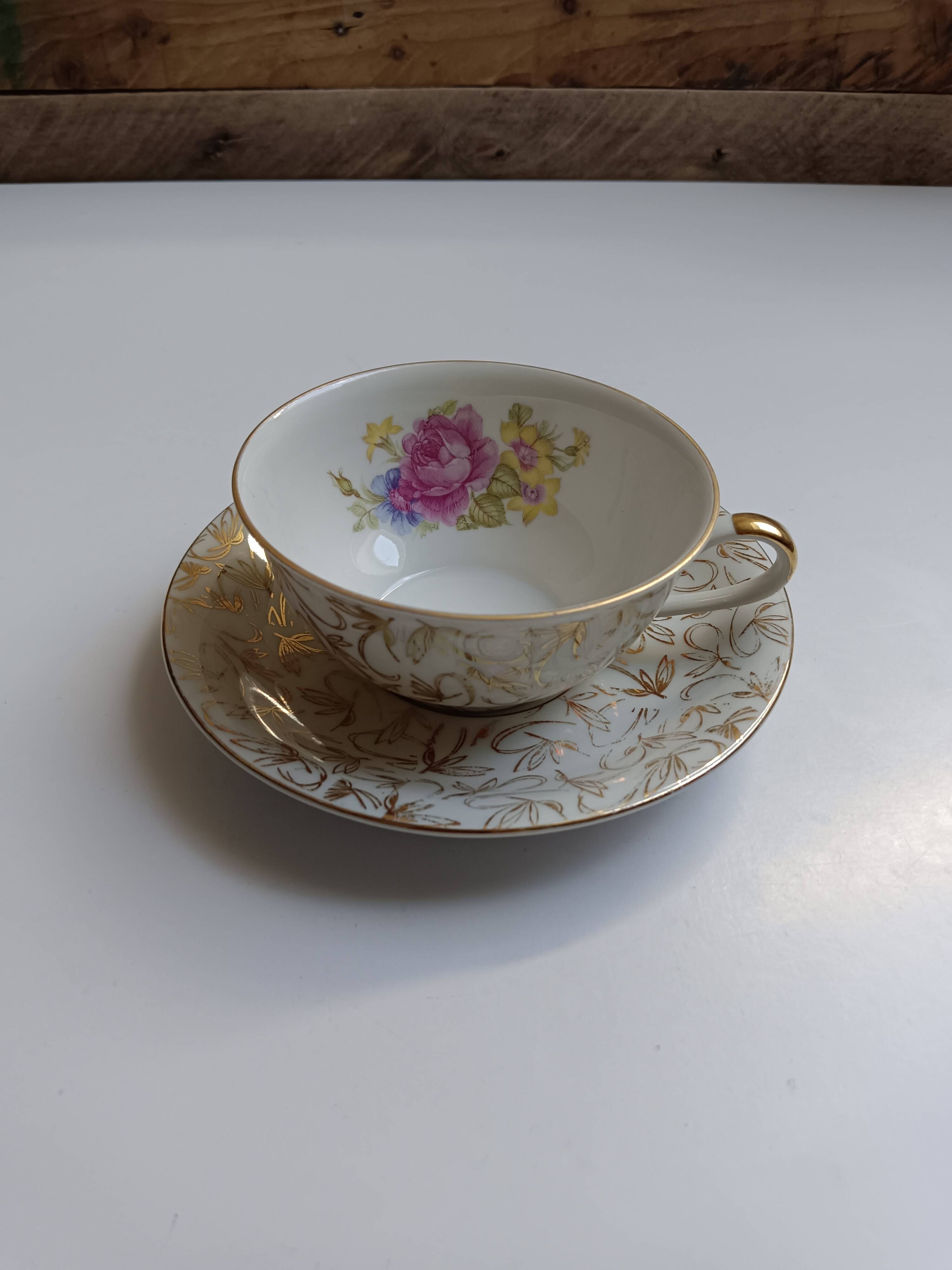 Large porcelain cup from Bavaria with a pearlescent finish and rose decorations.