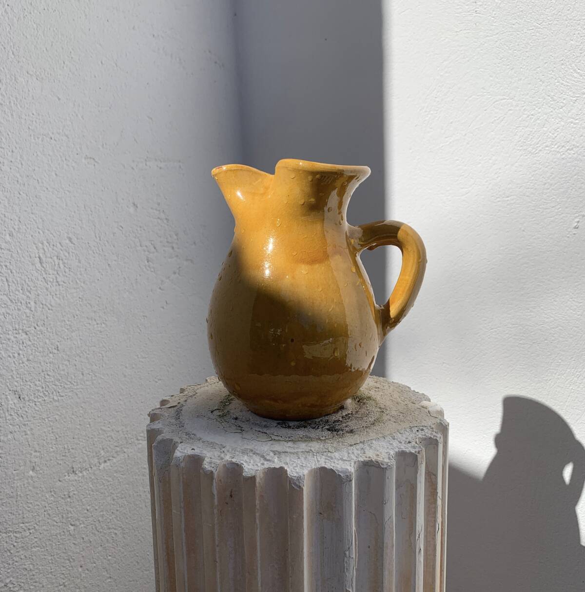 Large vintage artisanal glazed earthenware pitcher with pinched spout