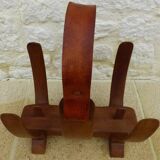 Unique piece of a magazine rack or log rack in solid oak pegged with leather handle