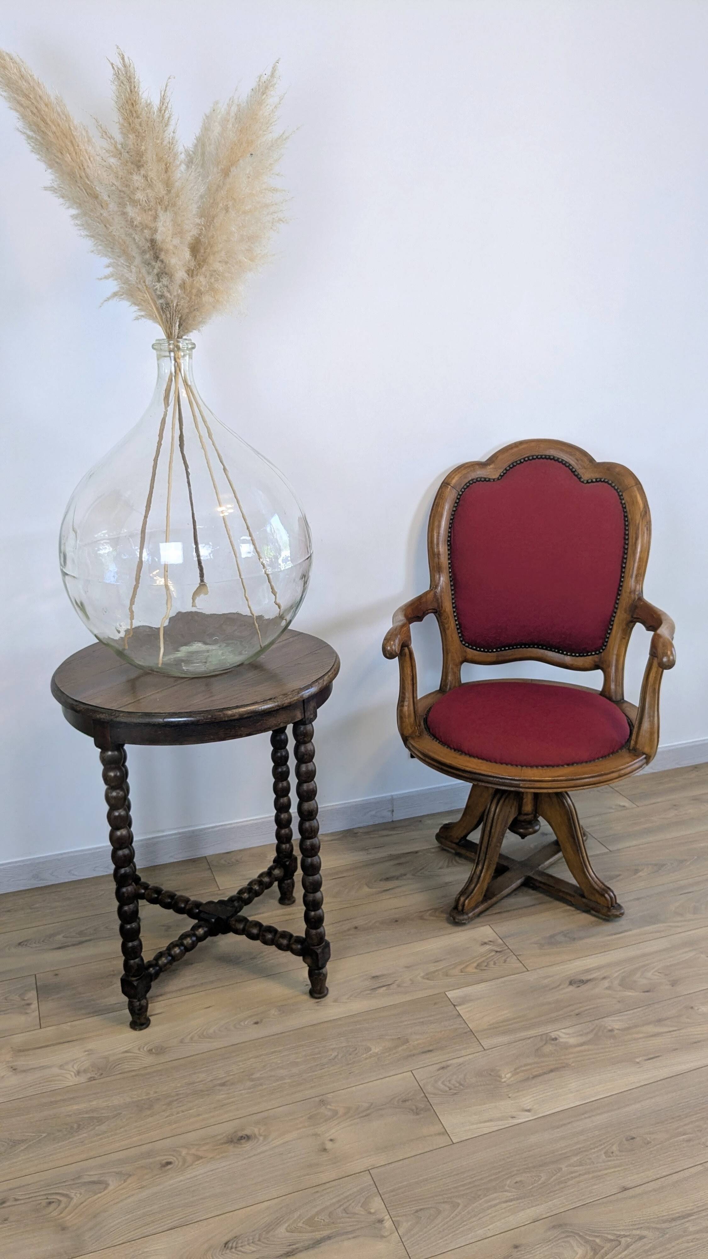 Vintage captain's chair in wood and garnet fabric — a seat with character