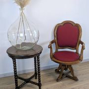 Vintage captain's chair in wood and garnet fabric — a seat with character